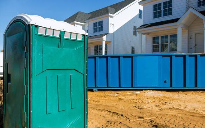 portable toilet and dumpster at a construction site in Wayne NJ